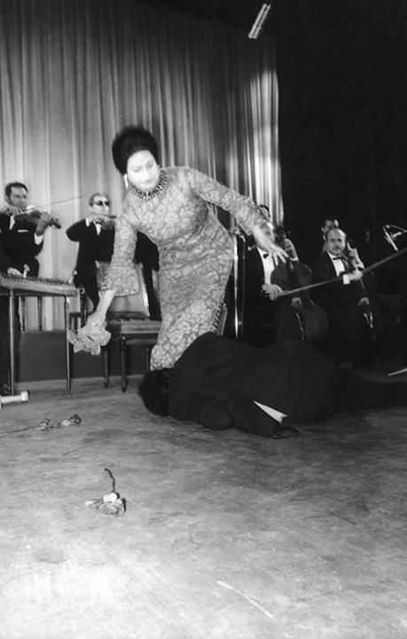 one of the audience in Paris interrupted Al Atlal song and jumped on the stage to kiss Oum Kulthoum's feet